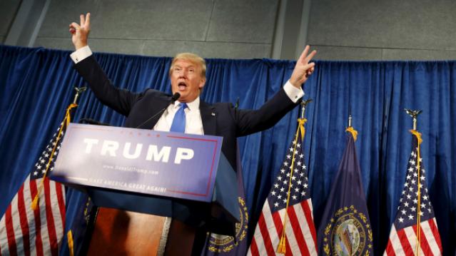 Republican presidential candidate Trump gestures after speaking and taking questions at a rally in Manchester