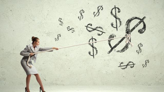 Businesswoman pulling rope