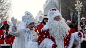 		<p>A man who is dressed up as Father Frost, the local equivalent of Santa Claus, and his "granddaughter" Snegurochka (Snow Maiden) greet passers-by during a New Year's Day parade in Bishkek.</p>