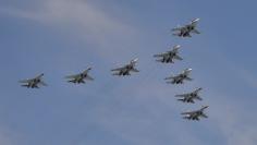 Sukhoi Su-30SM Flanker-C fighters and Su-35S Super-Flanker fighters fly in formation over the Red Square during the Victory Day parade in Moscow