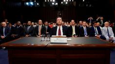 Former FBI Director Comey testifies before a Senate Intelligence Committee hearing in Washington