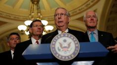 Senate Majority Leader Mitch McConnell, accompanied by Sen. Cory Gardner (R-CO), Sen. John Barrasso (R-WY) and Sen. John Cornyn (R-TX), speaks to the media following the weekly policy luncheons on Capitol Hill in Washington