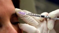 Howard Sobel, attending dermatologist and dermatologic surgeon at Lenox Hill Hospital in New York, demonstrates how botox or other anti-wrinkle medicines are applied via syringe to a patient at his office in New York