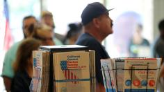 People line up to vote early inside the San Diego County Elections Office in San Diego, California