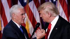 U.S. President-elect Donald Trump and Vice President-elect Mike Pence embrace at their election night rally in Manhattan, New York