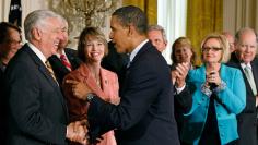 President Obama shakes hands with House Majority Leader Steny Hoyer, as Blue Dog Coalition Co-Chair Stephanie Herseth Sandlin, Senator Claire McCaskill, House Budget Committee Chairman John Spratt and other members of Congress look on, after Obama's PAYGO