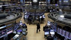 Traders work on the floor of the New York Stock Exchange