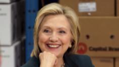 U.S. presidential candidate and former Secretary of State Hillary Clinton listens to small business owners as she campaigns for the 2016 Democratic presidential nomination at Capital City Fruit in Norfolk