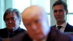 Trump advisers Bannon and Kushner listen as U.S. President Donald Trump meets with members of his Cabinet at the White House in Washington