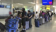 Passengers wait to check in to Delta Airlines flights following a system-wide computer breakdown, at Newark International Airport in Newark, New Jersey