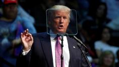 Republican presidential nominee Donald Trump reads from a t teleprompter as he speaks during a campaign rally in Everett