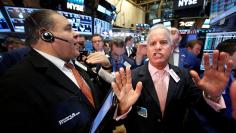 Traders work on the floor of the NYSE 