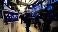 Traders work on the floor of the NYSE