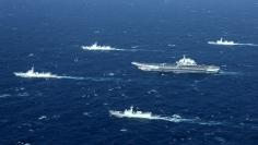 China's Liaoning aircraft carrier with accompanying fleet conducts a drill in an area of South China Sea