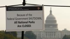 A sign on the National Mall tells visitors of the closures do to the federal government shutdown in Washington