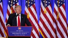 U.S. President-elect Donald Trump listens to a reporter ask a question during a news conference in the lobby of Trump Tower in Manhattan, New York City