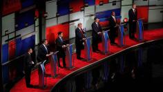 Republican U.S. presidential candidate businessman Donald Trump speaks as he stands amongst six rivals for the Republican presidential nomination during the Fox Business Network Republican presidential candidates debate in North Charleston