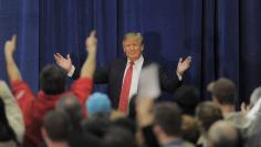 U.S. Republican presidential candidate Donald Trump acknowledges the crowd as he arrives at a campaign rally in Concord