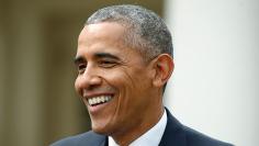 U.S. President Obama smiles at joint news conference at the White House in Washington