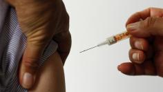 A nurse is given the vaccine against the H1N1 swine flu during a vaccination session for front line medical staff at the Countess of Chester Hospital in Chester