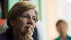 U.S. Senator Elizabeth Warren listens to workers tell their stories about erratic workplace schedules at the Equal Exchange Cafe in Boston