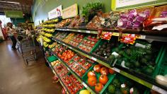 Shoppers stand by the vegetables aisle inside a Fresh & Easy store in Burbank