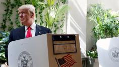 Republican presidential candidate Donald Trump fills his ballot for the New York primary election in the Manhattan borough of New York City