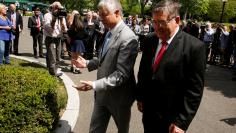 Upton and Burgess return to the West Wing after speaking to reporters about health care legislation after meeting with President Trump at the White House in Washington