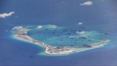 Still image from United States Navy video purportedly shows Chinese dredging vessels in the waters around Mischief Reef in the disputed Spratly Islands