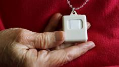 Inez Willis tests her medical alert device at her independent living apartment in Maryland