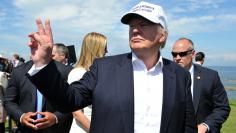 Republican presidential candidate Donald Trump gestures following a news conference, at his Turnberry golf course, in Turnberry