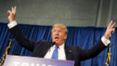 Republican presidential candidate Trump gestures after speaking and taking questions at a rally in Manchester