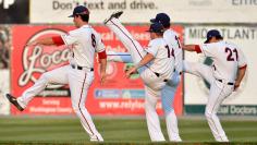 Minor League baseball players stretch in Maryland before game