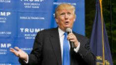 Businessman and Republican presidential candidate Donald Trump speaks to supporters during a back-yard reception in Bedford