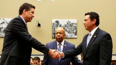 FBI Director Comey shakes hands with Chaffetz and Cummings before House Oversight and Government Reform Committee in Washington 