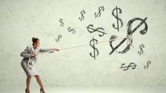 Businesswoman pulling rope