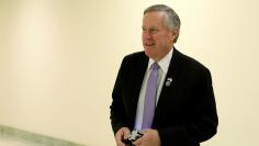 Mark Meadows walks in a hallway on Capitol Hill in Washington