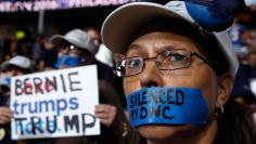 A supporter of former Democratic U.S. presidential candidate Bernie Sanders wears tape across her mouth at the Democratic National Convention in Philadelphia
