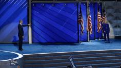 U.S. President Barack Obama points to Democratic presidential nominee Hillary Clinton as she walks on stage on the third day of the Democratic National Convention in Philadelphia