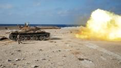 A fighter of Libyan forces allied with the U.N.-backed government fires a shell with Soviet made T-55 tank at Islamic State fighters in Sirte