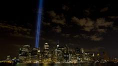 The Tribute in Light installation is illuminated over lower Manhattan as seen from Brooklyn Bridge Park in the Brooklyn borough in New York