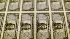 United States one dollar bills seen on a light table at the Bureau of Engraving and Printing in Washington