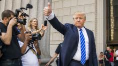 U.S. Republican presidential candidate Donald Trump gestures as he arrives for jury duty at Manhattan Supreme Court in New York