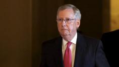 Senate Majority Leader McConnell walks to his weekly party caucus luncheon at the U.S. Capitol in Washington