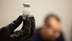 Gail Dufault, the Transitional Healthcare Coordinator at the Barnstable County House of Corrections, checks that a dose of Vivitrol is mixed properly before administering the drug to an inmate at the prison in Buzzards Bay