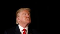 Republican presidential nominee Donald Trump listens to a question as he appears at the "Retired American Warriors" conference during a campaign stop in Herndon