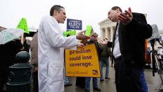 Fagel argues in favor of Obamacare with Kerpen in front of the Supreme Court building in Washington