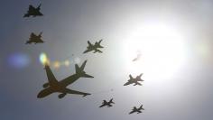 Military planes fly in formation during a NATO military exercise at the Birgi NATO Airbase in Trapani