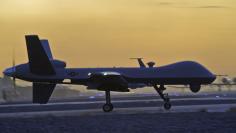 A MQ-9 Reaper drone taxis at Kandahar Airfield, Afghanistan