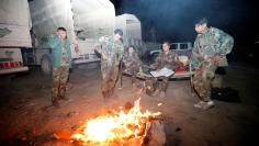 Peshmerga forces gather on the east of Mosul during preparations to attack Mosul